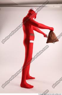 JOEL_ADAMSON CHRISTMAS VALLAIN WITH GUN AND BAG